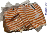 A stack of orange and white striped clothing items, featuring a cozy and stylish Genuine Le Tigre Knit Hat Winter Beanie made from 100% acrylic, still wrapped in clear plastic packaging, displayed on a white background.