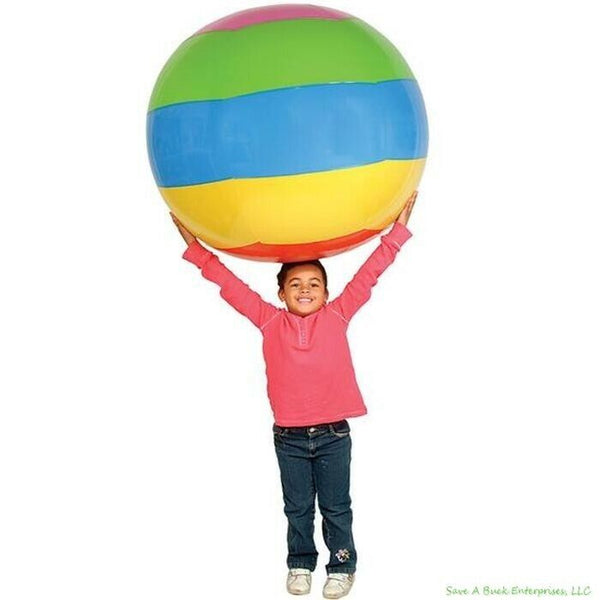 A child in a pink top holds the Beach Ball HUGE 48" Inch Rainbow Inflatable 4 FT JUMBO Pool Luau Inflate Toy with multicolored horizontal stripes above their head.