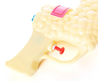 Close-up of the SPITTIN' LLAMA Water Pistol Squirt Gun, a novelty toy featuring a textured handle resembling popcorn, with a red trigger and a red button on top.