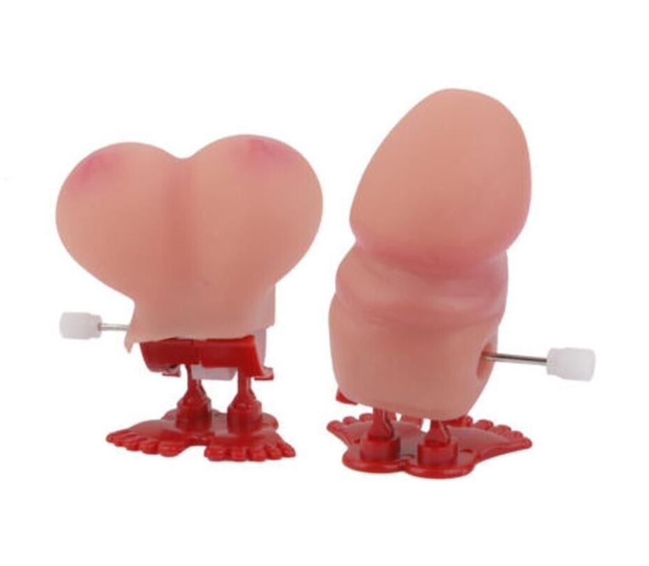 The 1 Jumping Boobie & 1 Pecker - Wind up Set features two novelty wind-up toys with anthropomorphic shapes resembling buttocks and genitalia, standing on red feet with winding keys on their sides—perfect for adding a touch of hilarity to kids' birthday parties or as quirky party decorations.