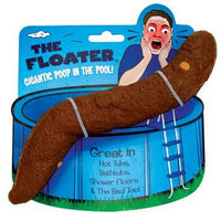 A plastic novelty toy resembling a realistic turd is packaged with a blue card featuring an illustration of a shocked person near a pool. The text reads, "1 Huge 10 inch Floating Poop - Fake Turd for Pool Hot Tub - Gag Gift Joke Prank.