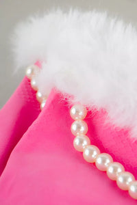 Get a close-up view of the Pink & Pearly Diamond Luxury Glam Gloves, crafted from pink textured fabric with a chic white fluffy trim and an elegant string of pearls. These glamorous dishwashing gloves transform a mundane chore into an opulent experience, making them the perfect gag gift for those who enjoy humor intertwined with sophistication.