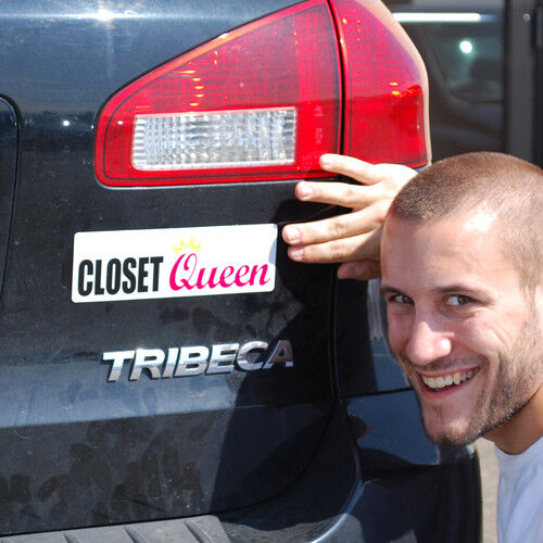 A person smiles while showing off a "Closet Queen" magnetic bumper sign on the back of their Tribeca vehicle, surrounded by hilarious prank car magnets like "I Love Porn" and "Adult Bookstores.