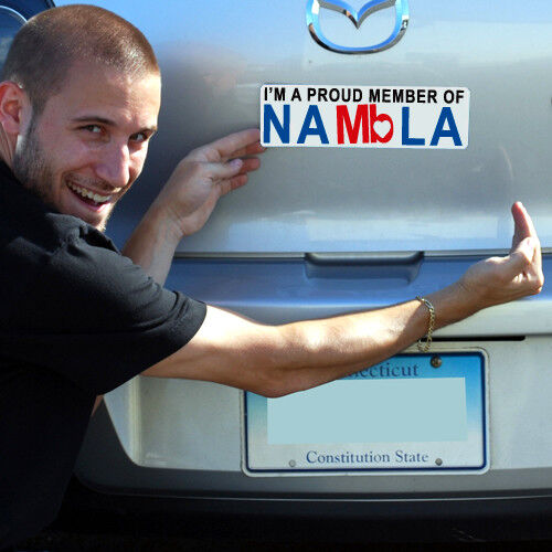 A smiling man points at a hilarious magnetic bumper sign on a car that reads "I Love Porn" from the set of 4 Prank Car Magnets, with a Connecticut license plate visible below.