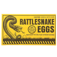 Yellow sign with an image of a rattlesnake and text reading "Caution: Handle with Care, Rattlesnake Eggs, Must Be Kept in a Cool Place to Prevent Hatching." Ideal for party favors or as part of the 144 Prank Rattlesnake Egg Envelope - Novelty Gag Joke Gift Toy - Wholesale Lot.