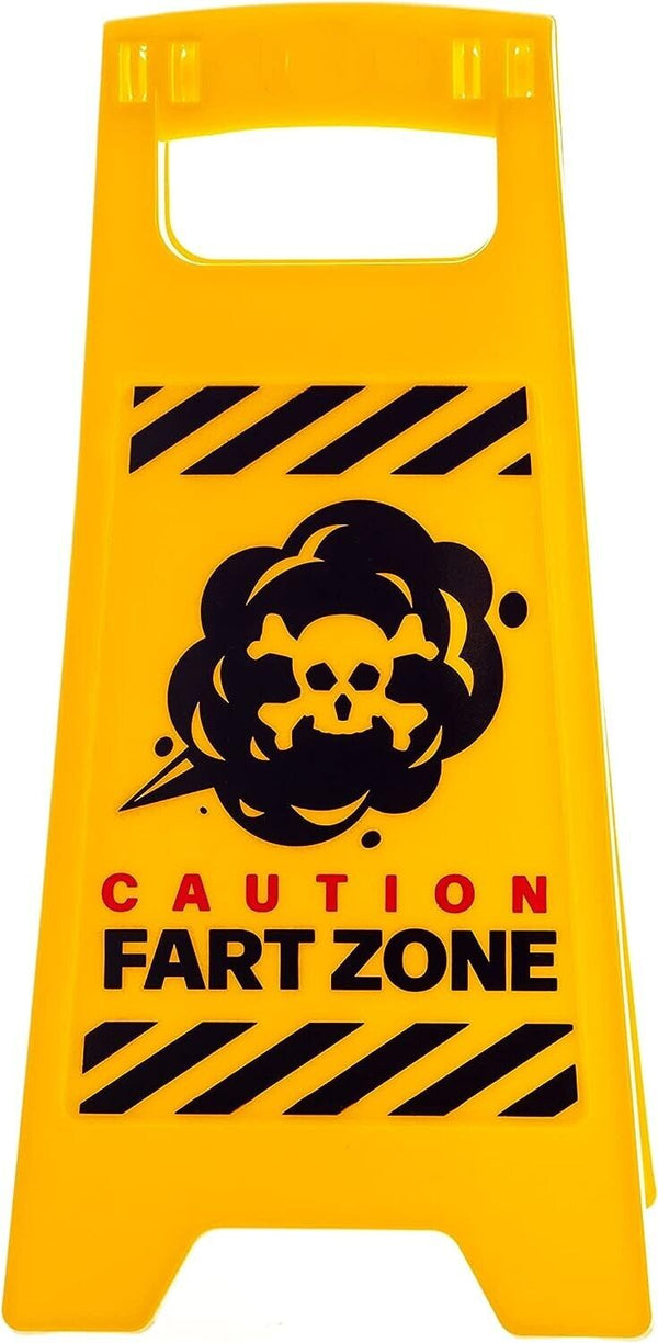 The Fart Zone Desk Warning Sign Hilarious Office Gift Accessory features a yellow warning sign with a black skull graphic and text reading "CAUTION FART ZONE." This hilarious gag gift is perfect for fans of toilet humor.