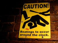 Caution Beatings Around Clock Metal Fight Sign - Funny as hell! Gag Joke Mancave