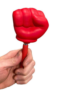 A hand holds the Giant 22" Extending Boxing Punch Glove - Snore-no-More! A red toy fist on a stick, it's perfect for anyone seeking the ideal gag gift.