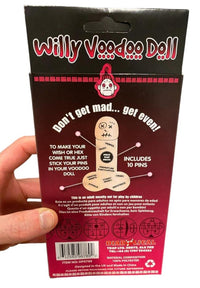 A hand holding a package labeled "Willy Voodoo Doll with Pins - Funny Adult Gag Joke Gift - Prick that Pecker!!" The package includes 10 pins and instructions stating "Don't get mad... get even!" Suitable for adults only. Perfect as a hilarious white elephant gift, it features a comic-style illustration of the voodoo doll.