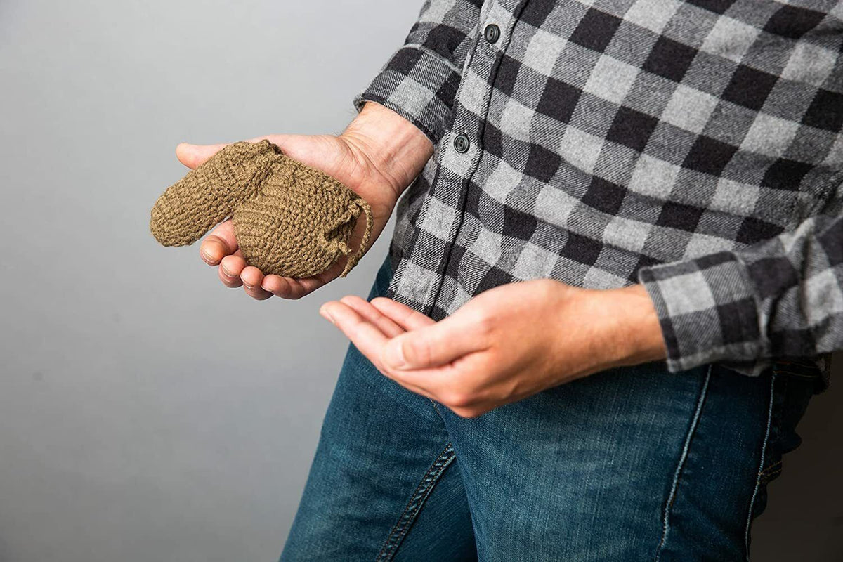 A person in a plaid shirt and jeans holds a small ARMY MILITARY Willy Warmer Weiner Weener Knitted Sock in their hand, making it the perfect gag gift from Big Mouth Inc.