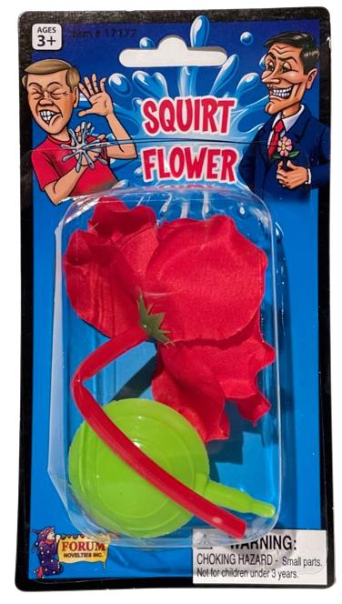 Packaging for the "Classic Lapel SQUIRT FLOWER Clown Rose Joke Prank Squirting Water Formal Costume," a novelty toy designed as a red fake flower with a green pump and tube—perfect for a classic clown gag. The warning label indicates a choking hazard for children under 3 years.