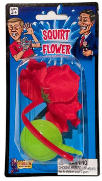 Packaging for the "Classic Lapel SQUIRT FLOWER Clown Rose Joke Prank Squirting Water Formal Costume," a novelty toy designed as a red fake flower with a green pump and tube—perfect for a classic clown gag. The warning label indicates a choking hazard for children under 3 years.