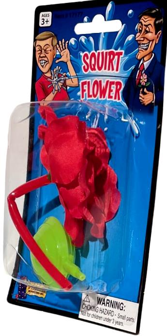 This "Classic Lapel SQUIRT FLOWER Clown Rose Joke Prank Squirting Water Formal Costume" toy, perfect as a clown gag for ages 3 and up, features a vibrant red flower connected to a green bulb. Includes a warning label about small parts posing a choking hazard.