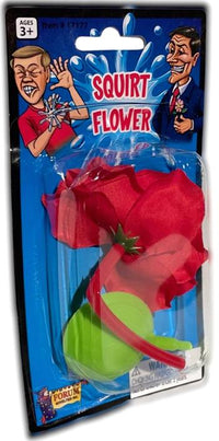 The packaging of the Classic Lapel SQUIRT FLOWER Clown Rose Joke Prank Squirting Water Formal Costume features splashes of water and cartoon characters on the front. The red squirt flower with a green base is perfect for clown gags, making it an ideal prank gag gift. The packaging indicates that it is suitable for ages 3 and up.