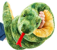 Someone is holding the Giant 100 Inch Long Anaconda Snake Plush Stuffed Animal Toy - Amazing!, which features a large green body with a yellow underside and realistic markings. This plush snake boasts a red forked tongue and detailed scale-like texture.