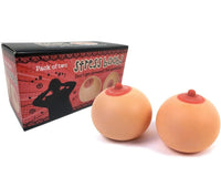 Introducing a funny gag gift: the "2pk Stress Boobs - Squeeze Boobies Feels Real! Adult Novelty Breast Man Toy Gift." This pack includes two stress balls in the shape of breasts, complete with packaging featuring a silhouette design. It's sure to provide laughs and serves as an ideal prop to hone your juggling skills.