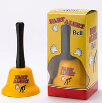 A yellow bell with a black handle that reads "Fart Alert" is displayed next to its packaging, which shares the same humorous text and design. The FART ALERT Hand Bell - Funny Joke GaG Gift - Farting Stink Bomb Warning features a whimsical warning system and comes in a box depicting a person releasing gas, making it an ideal gift for pranksters.