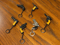 12 Vintage 80's mini key chain diecast metal pistol cap gun - die cast display