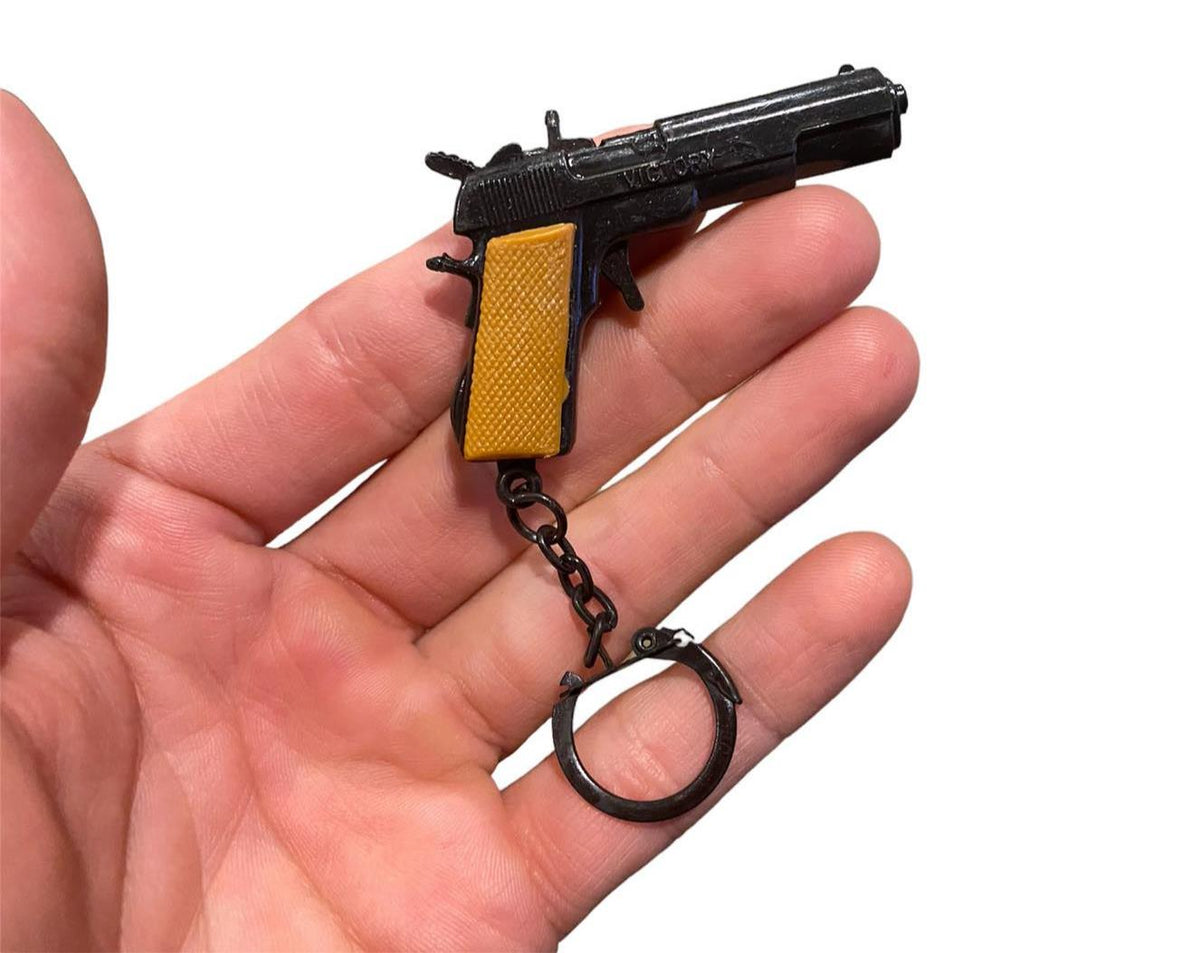 12 Vintage 80's mini key chain diecast metal pistol cap gun - die cast display