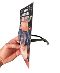 This humorous gag gift, the Senior Citizens Old Magni-Vision - Over the Hill Magnify Eyes Glasses, features oversized glasses attached to cardboard packaging marked "Senior Citizens Magna Vision.