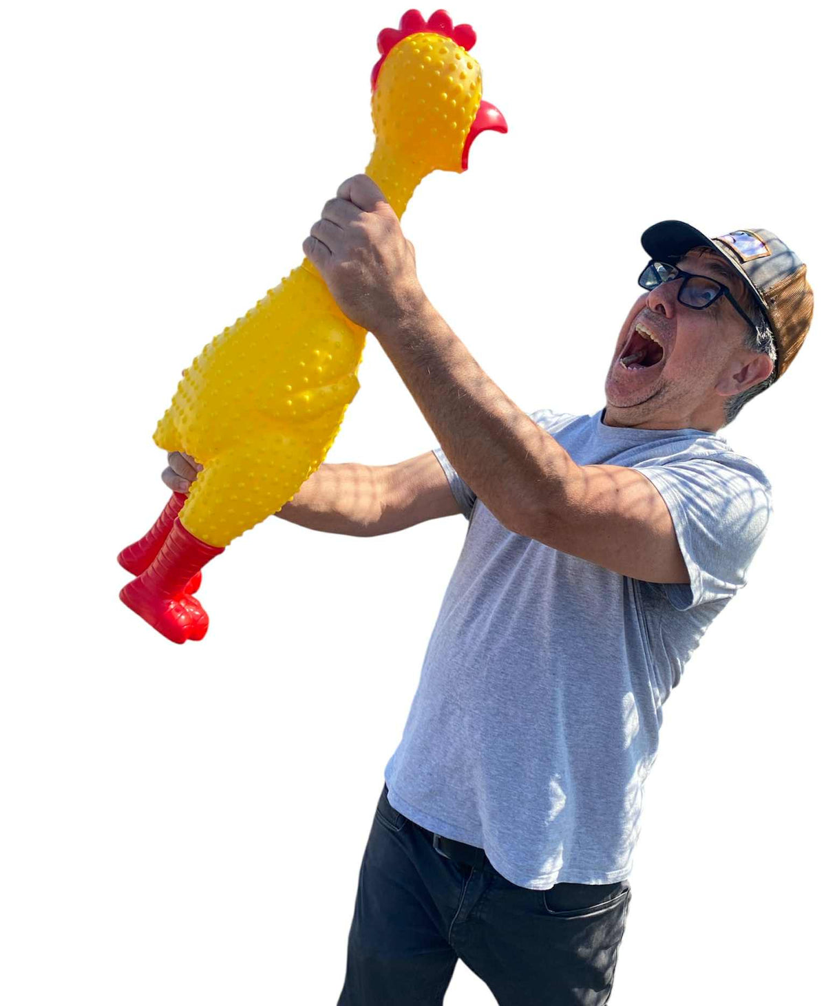 A man in a gray t-shirt and cap holds up the GIANT 27" Rubber Chicken—the biggest, loudest squeaky toy and hilarious gag gift—staring at it with a surprised, wide-mouthed expression.