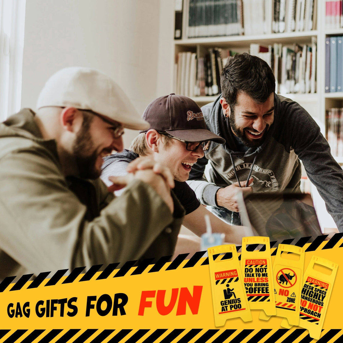 Three men laugh at a table surrounded by hilarious gag gifts. Below are the ⚠️ 4 Pack Funny Warning Desk Signs ⚠️—the perfect office humor gag gift set. A banner overhead reads "Gag Gifts for Fun.