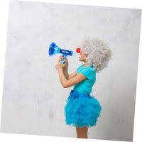 A child in a curly white wig, red clown nose, and blue dress holds the Voice Changer Megaphone Toy – a bullhorn mic with 10 funny sound effects – against a plain light background.