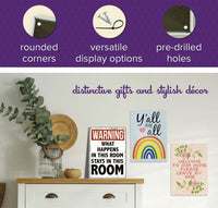 Decor setup featuring a wooden cabinet and various decor signs, including the "Home is Where the WIFI Connects Automatically" metal tin sign. This sign comes with rounded corners, versatile display options, and pre-drilled holes, making it an ideal charming gift for any home decor enthusiast.