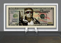 A fictional 2024 dollar bill featuring a stylized portrait of a man in sunglasses and a leather jacket, labeled "Federal Note to Victory," beautifully displayed in the DELUXE Currency Slab Dollar Bill Plastic Case to protect your novelty money.