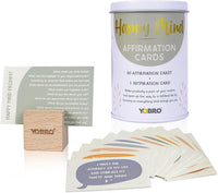 A tin labeled "40 Positive Daily Quote Cards with Wooden Stand" includes motivational cards and a wooden holder—an inspiring self-care gift and stylish desk decor for mental well-being.