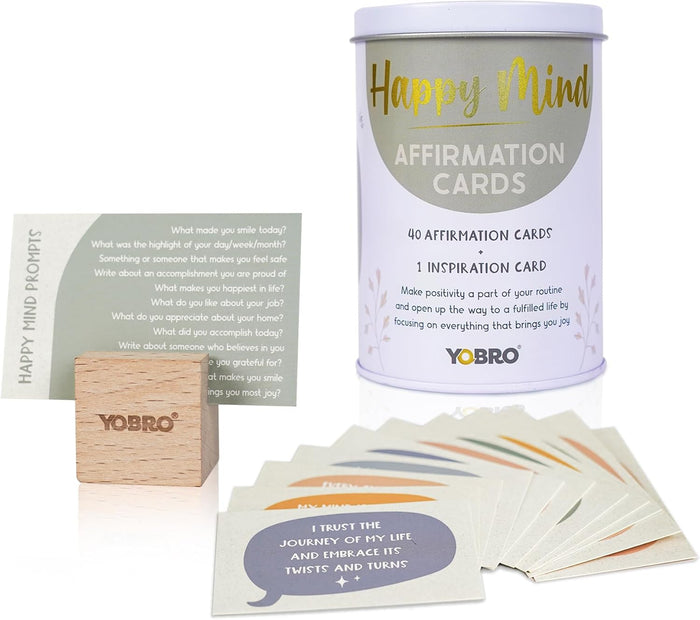 A tin labeled "40 Positive Daily Quote Cards with Wooden Stand" includes motivational cards and a wooden holder—an inspiring self-care gift and stylish desk decor for mental well-being.