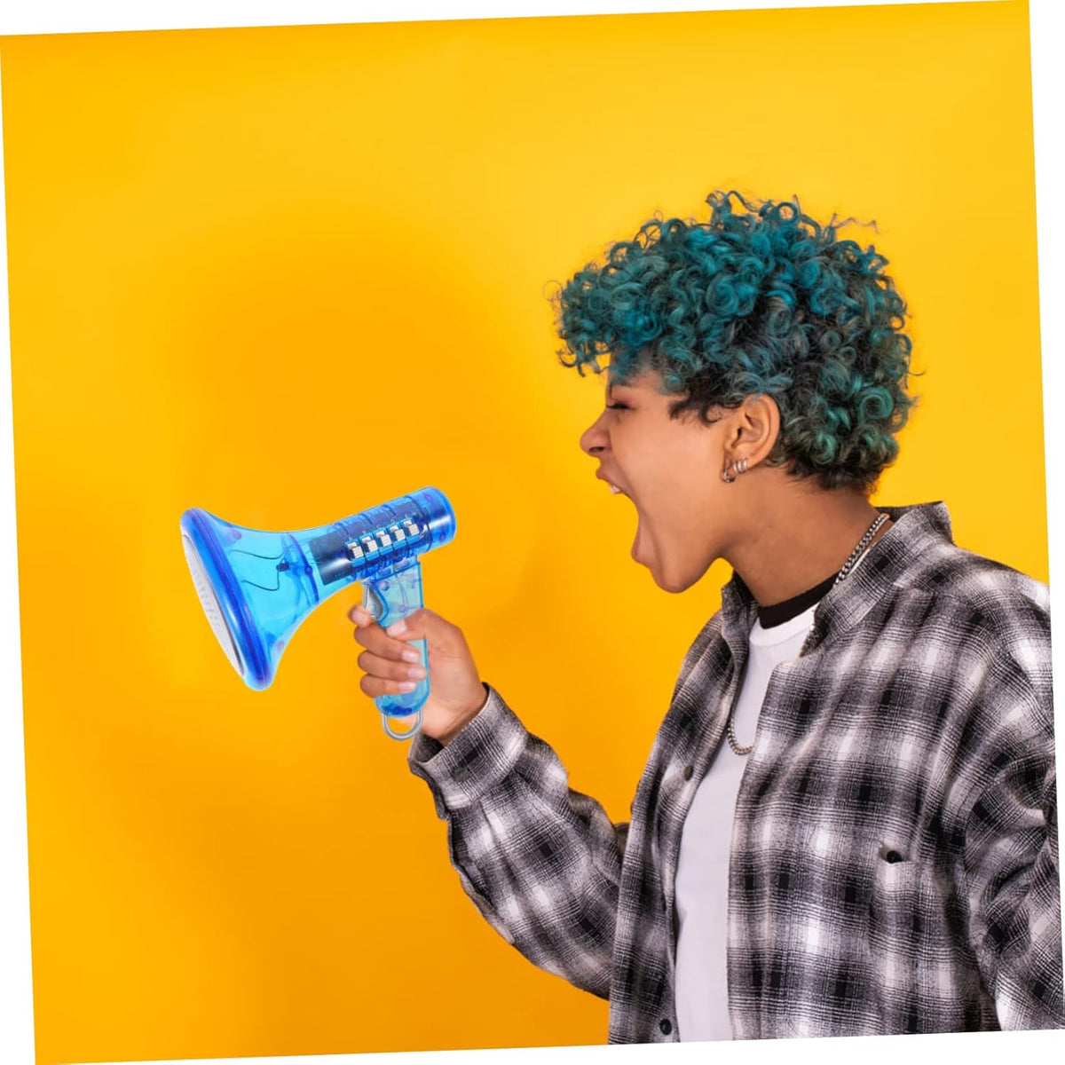 A person with teal curly hair in a plaid shirt shouts into a blue Voice Changer Megaphone Toy – 10 Funny Sound Effects Bullhorn Mic – as LED lights flash, set against a bright yellow background.