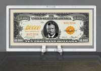 A framed $10,000 gold certificate banknote with a portrait of Salmon P. Chase, elegantly showcased in a Deluxe Currency Slab Dollar Bill Plastic Case displayed on a stand.