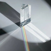 The "PRISM - Fun Educational Science Rainbow Light of Colors" by Archie McPhee uses optical principles to refract light on a surface, producing a spectacular rainbow effect.