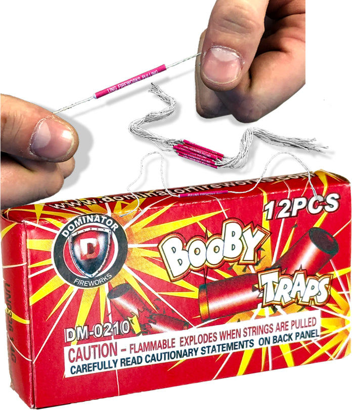 A person pulls apart a 12-PACK - BOOBY TRAP STRINGS 💥 💣 Funny Classic Joke Gag Pranks, known for their loud string effect, above a box with warning and caution information visible.