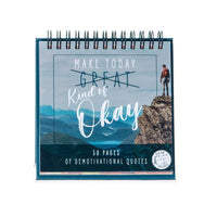 A unique gift, the "Demotivational Quotes Desk Spiral Flip Book - Hysterical Message Table Signs" showcases a hiker overlooking a mountain landscape. This desktop flip book includes 50 pages of demotivational quotes, ideal for bringing a humorous touch to your workspace.