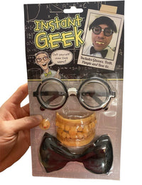 A hand holds the Instant Geek Costume Kit featuring glasses, fake teeth, bow tie & pimple—an all-in-one nerd dress up set with fun gag accessories and a model displaying this novelty gift.