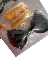 The Instant Geek Costume Kit 🤓 includes fake yellow teeth, glasses, a large black bow tie, and a red pimple button—perfect as a nerd accessory or funny gag gift. All items shown on a white background.