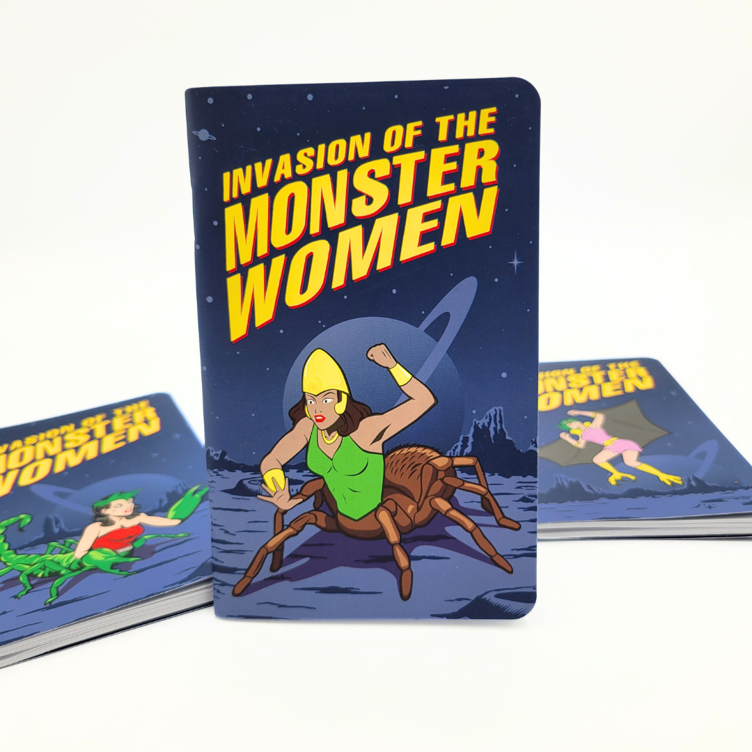 The 3PK Monster Women Notebook Journals by Archie McPhee, titled "GIRL POWER!," make an ideal gift with their comic-style cover called "Invasion of the Monster Women," showcasing a captivating image of female monsters, including a woman with a spider body in space.