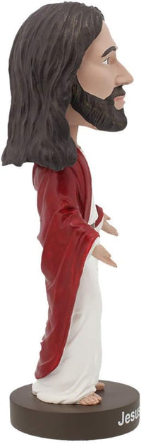 Side view of the 🙏 Jesus Bobblehead Figure – a premium lifelike collectible gift by Royal Bobbles✝️, featuring long hair, red robe, white garment, and standing on a round “Jesus” base.
