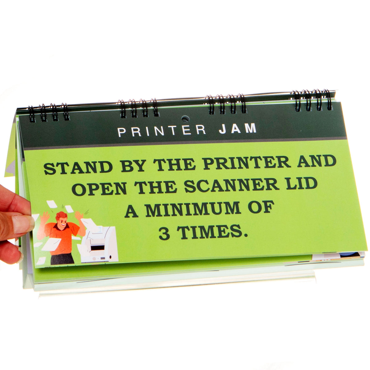 A sign in the **How to "LOOK BUSY" at Work - Slacker's Guide - Funny Desk Spiral Flip Book Signs** humorously instructs, "Stand by the printer and open the scanner lid a minimum of 3 times," with an accompanying image of a frustrated person dealing with a printer jam. This could make for your next hilarious office gift or Secret Santa surprise!