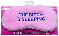 The "THE BITCH IS SLEEPING" mask, a fluffy pink sleep accessory with a bold blue phrase, is a hilarious novelty gift and funny eye blindfold for women.