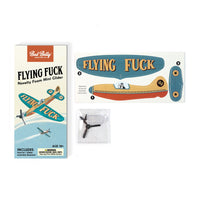 Box and components of the ✈️🤣 FLYING FU%K – The Mini Plane Glider That Says It All! 🙌😂 Adult Gag Joke, including plane parts and a small bag with a propeller.