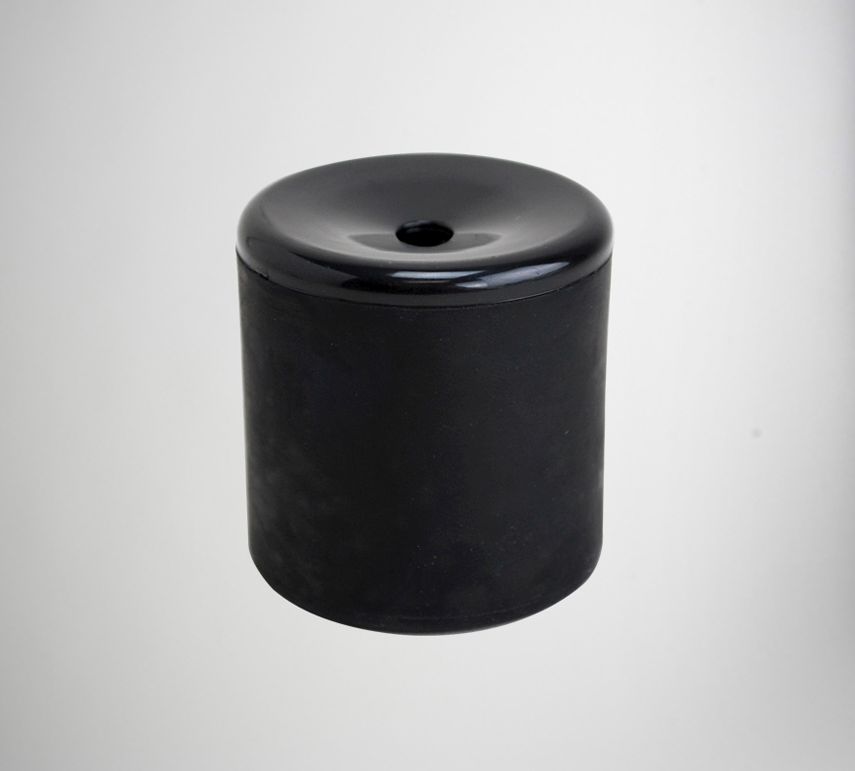 This cylindrical black object with a smooth, shiny finish and a central hole on the top surface is an impeccable representation of the 12 Le Tooter Pooters - Party Favor Gag Joke Fart Farting Gifts (1 dozen), an artificial flatulence maker sure to bring humor to any situation.