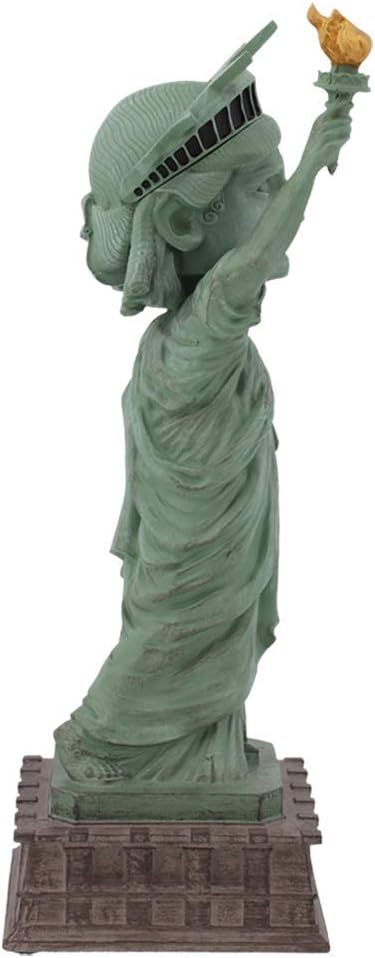 The Statue of Liberty Bobblehead Figure 🗽 – Premium Lifelike Collectible Decor Gift captures a child as Lady Liberty, torch held high atop a pedestal—perfect for collectors and decor lovers alike.
