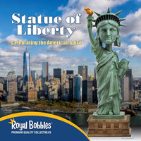 The Statue of Liberty Bobblehead Figure 🗽 – Premium Lifelike Collectible Decor Gift is shown in front of the New York City skyline, highlighting this must-have collectible from Royal Bobbles.