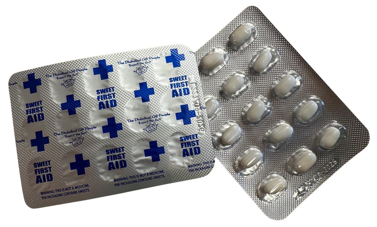 Two blister packs: one sealed with blue crosses and "SWEET FIRST AID," the other open with white oval tablets. Trumptacs Mints – Funny Donald Trump Candy Box of 30, perfect gag gift for anyone who loves a presidential twist!.