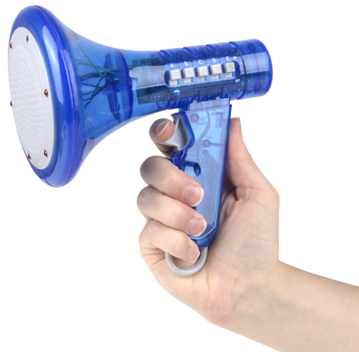 A hand holding the Voice Changer Megaphone Toy – a small blue bullhorn mic with labeled buttons, flashing LEDs, and visible internals. Features 10 funny sound effects for kids and adults.