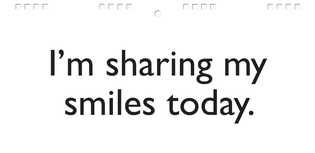 Text on a white background states, "I'm sharing my smiles today." This resembles the Workplace Mood Swings desk spiral flip book, an ideal tool for injecting joy into office communication and a delightful gift for co-workers.